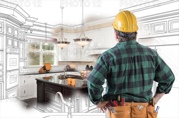 Male contractor with hard hat and tool belt looking at custom kitchen drawing photo combination on white