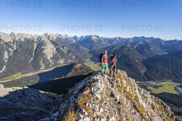 Two female hikers on a summit