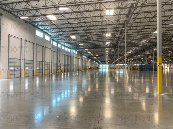 Massive empty industrial warehouse interior