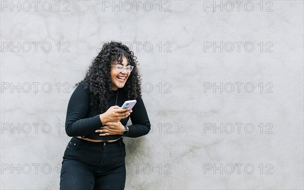 Pretty girl happy with her cell phone