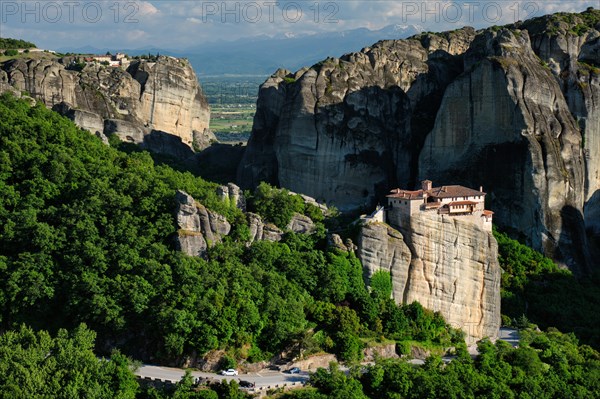 Monastery of Rousanou and Monastery of St. Stephen in famous greek tourist destination Meteora in Greece on sunset with scenic landscape