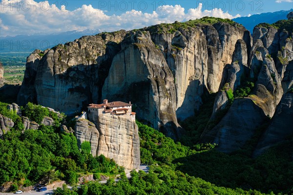 Monastery of Rousanou in famous greek tourist destination Meteora in Greece on sunset with scenic landscape