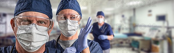 Team of female and male doctors or nurses wearing personal protective equipment in hospital emergency room