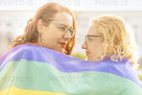 Lesbian women couple in love embracing each other