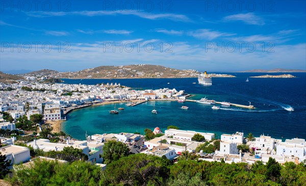 View of Mykonos town Greek holiday vacation destination with famous windmills