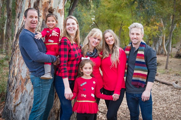 Multigenerational mixed-race family portrait outdoors