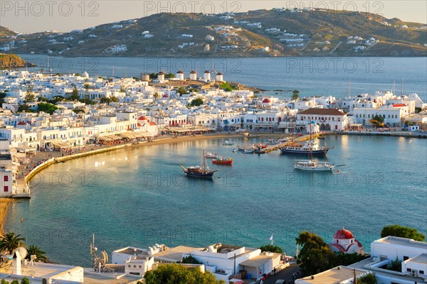 View of Mykonos town Greek tourist holiday vacation destination with famous windmills