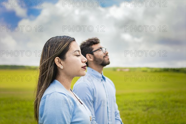 Two people breathing fresh air in the field
