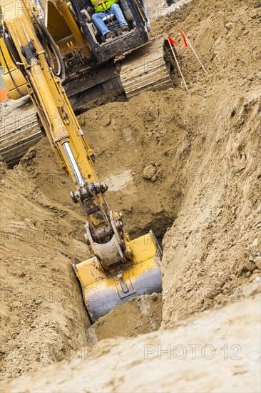 Working excavator tractor digging A trench