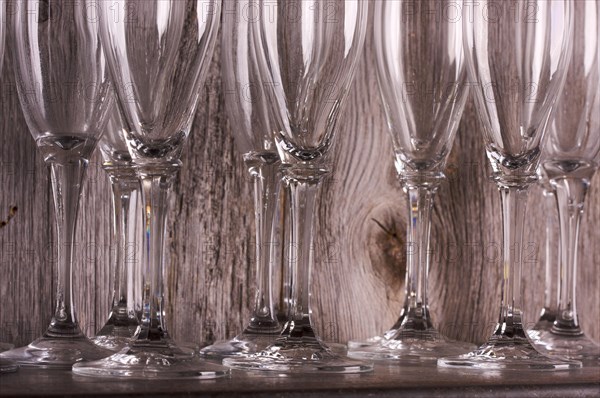 Champagne flutes on shelf abstract