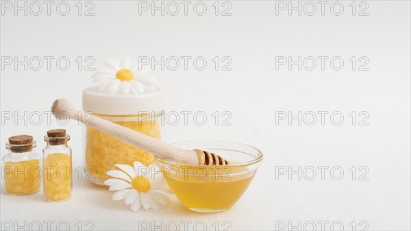 Arrangement with honey salts white background