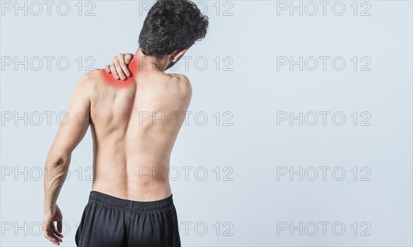 Shirtless man with neck pain