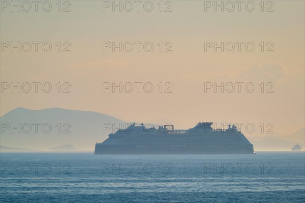 Cruise liner ship silhouette in Mediterranea sea. Aegean sea