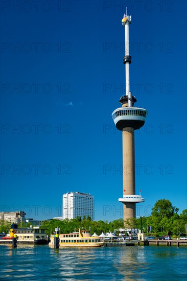 Rotterdam cityscape with Euromast observation tower and tourist boat on Nieuwe Maas river