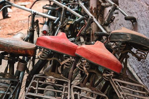 Bicycle saddles close up in Indian street