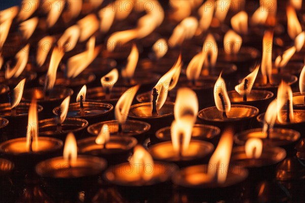 Burning candles in Buddhist temple. Dharamsala