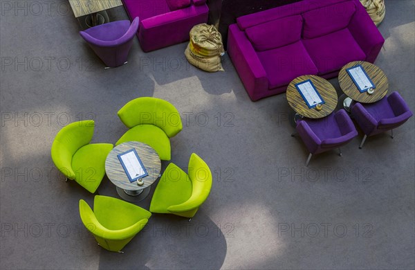 Arrangement of coloured club chairs in the restaurant