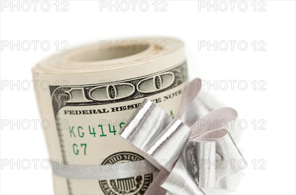 Roll of one hundred dollar bills with silver bow on white