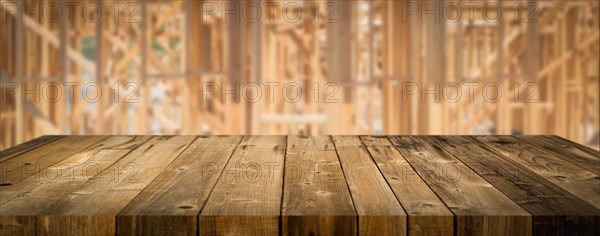 Empty wood table surface display background with construction theme behind