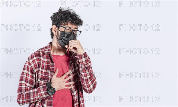 Man coughing with surgical mask