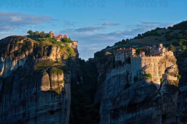 Monastery of Varlaam and Great Meteoron Monastery in famous greek tourist destination Meteora in Greece on sunrise