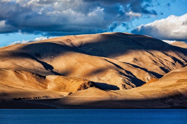 Himalayas and Himalayan mountain lake Tso Moriri on sunset. Korzok