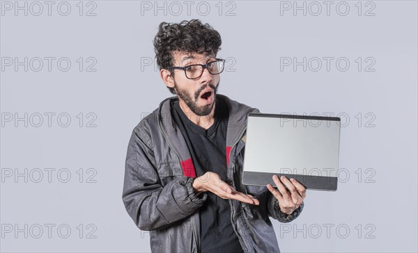 Young man holding poster