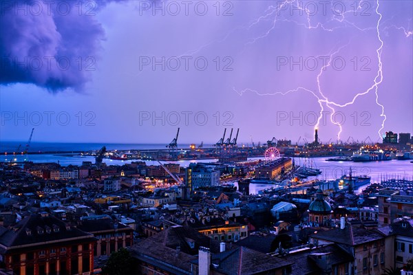 Port of Genoa with port cranes and industrial area