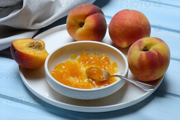 Peach jam in shell and peach tree