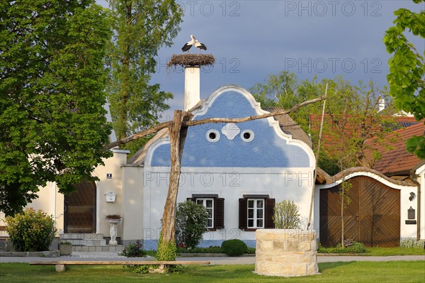 Hufnagl House with stork's nest and draw well