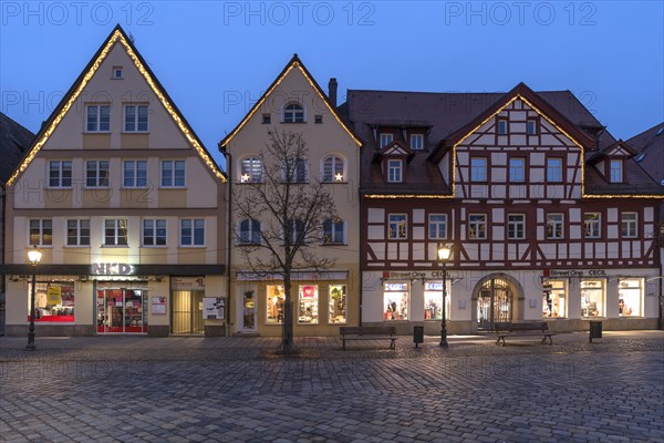 Historic gabled houses on the market place in the evening