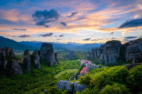 Monastery of Rousanou and Monastery of St. Nicholas Anapavsa in famous greek tourist destination Meteora in Greece on sunset