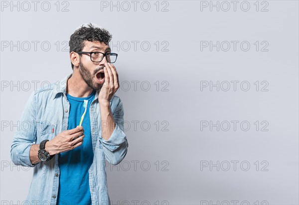 Person with brush with bad breath problem