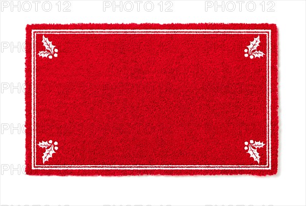 Blank holiday red welcome mat with holly corners isolated on white background