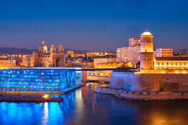 Marseille Old Port and Fort Saint-Jean and Museum of European and Mediterranean Civilisations and Marseille Cathedral illumintaed in night