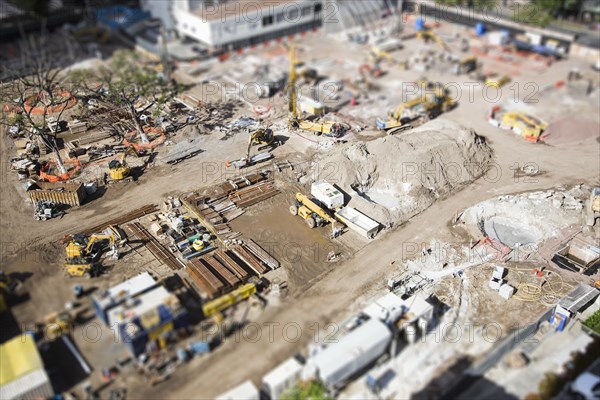 Aerial view of busy construction site with extreme bokeh