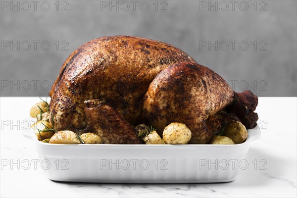 Arrangement with roasted turkey on a tray