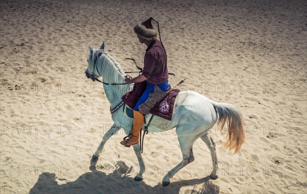 Ottoman horseman in his ethnic clothes riding on his horse