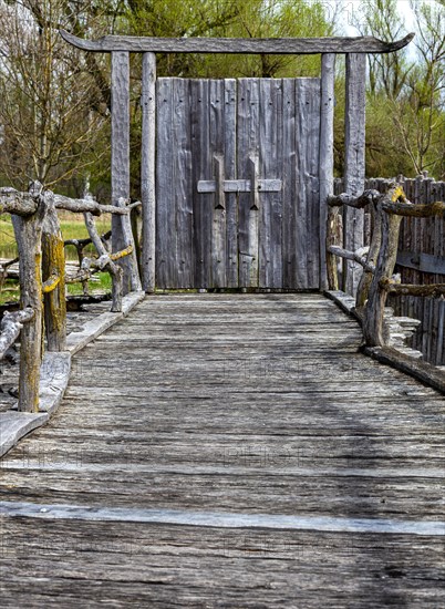 Wooden gate at the entrance to the pile village in Unteruhldingen on Lake Constance