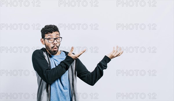 Person pointing palms to the side