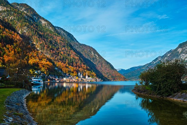 Austrian tourist destination Hallstatt village on Hallstatter See lake lake in Austrian alps with tourist boat