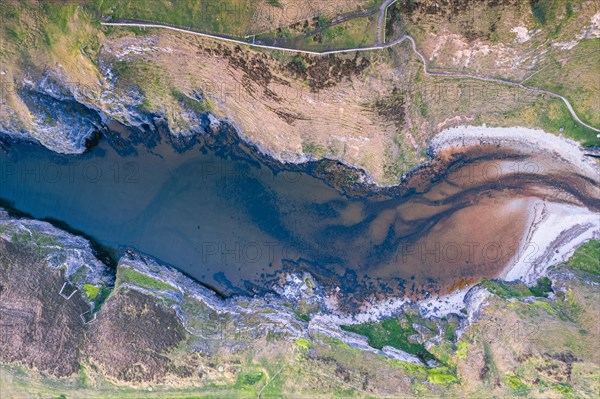 Top Down view over Geodha Smoo and Smoo Cave Cliffs from a drone