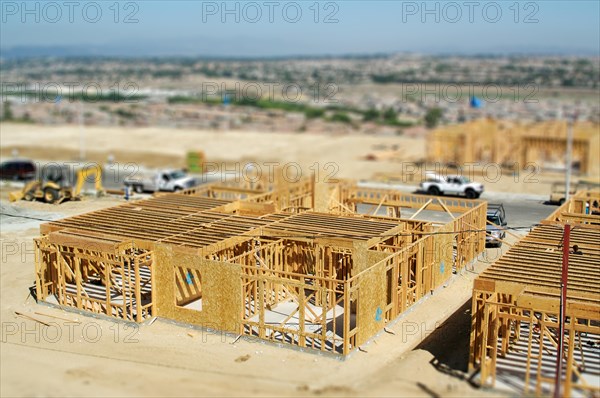 Aerial view of new homes construction site with tilt-shift blur