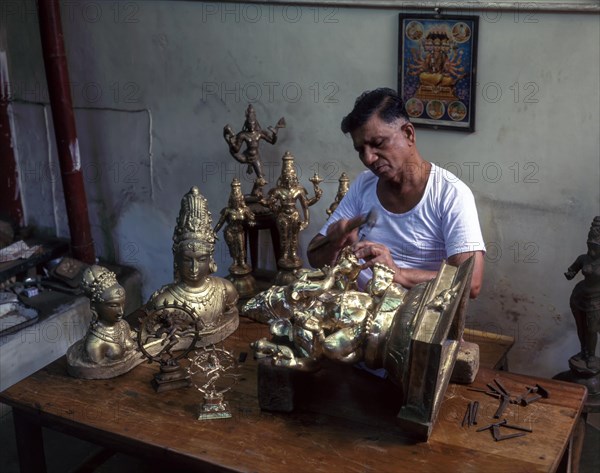 Artisan making bronze sculptures