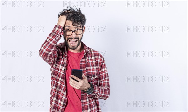 Worried young man with his phone in his hand