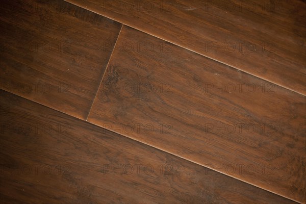 Newly installed brown laminate flooring abstract