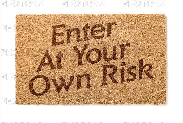 Enter at your own risk welcome mat isolated on A white background