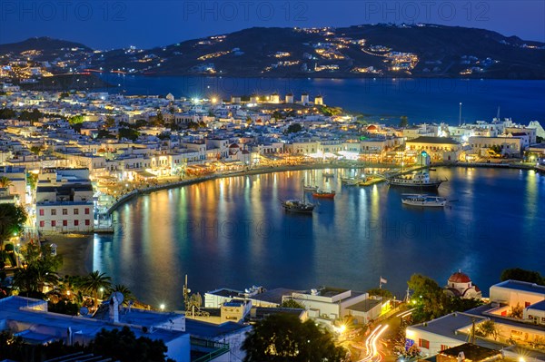 View of Mykonos town Greek tourist holiday vacation destination with famous windmills