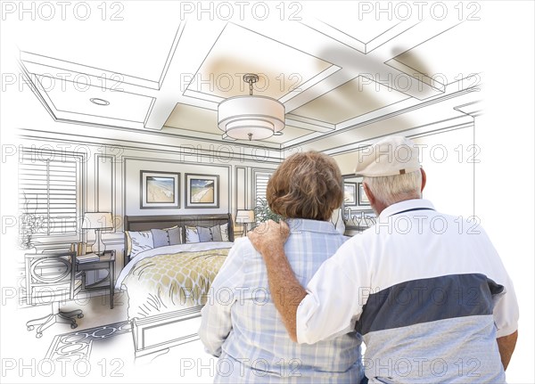Curious senior couple looking over custom bedroom design drawing photo combination