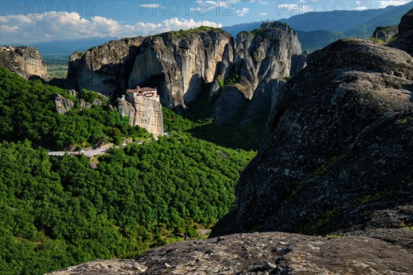 Monastery of Rousanou and Monastery of St. Stephen in famous greek tourist destination Meteora in Greece on sunset with scenic landscape